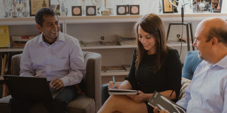 Three Walker sands employees meeting in Chicago office
