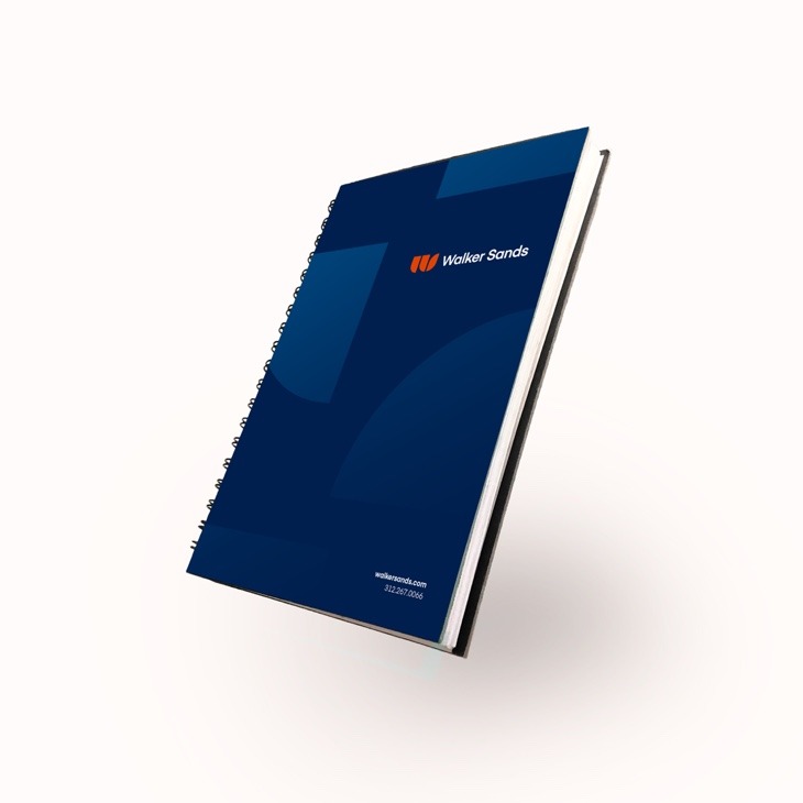 Blue notebook showcasing the new Walker Sands brand and logo