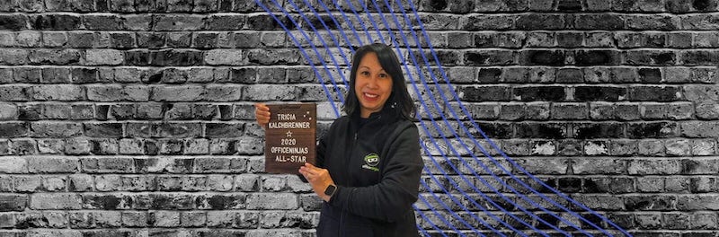 Trish Kalchbrenner holding OfficeNinja Award 2020