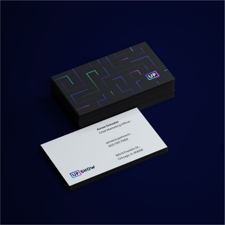 Mockup of UPshow's business cards in new branding.