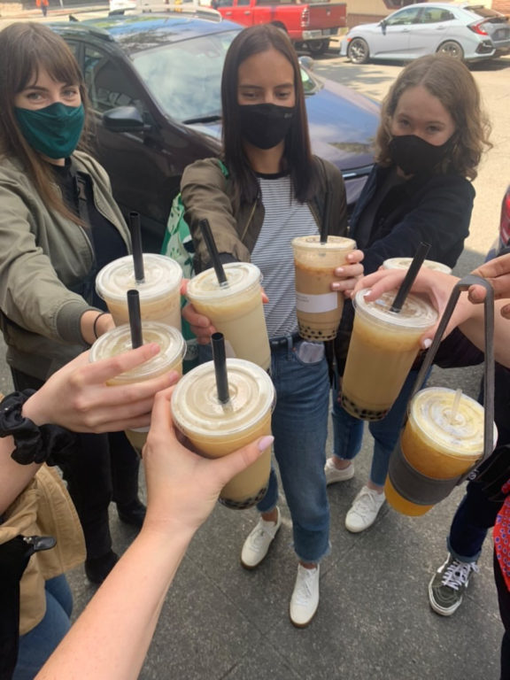 The Walker Sands Seattle team doing a cheers during their annual International District Food Crawl