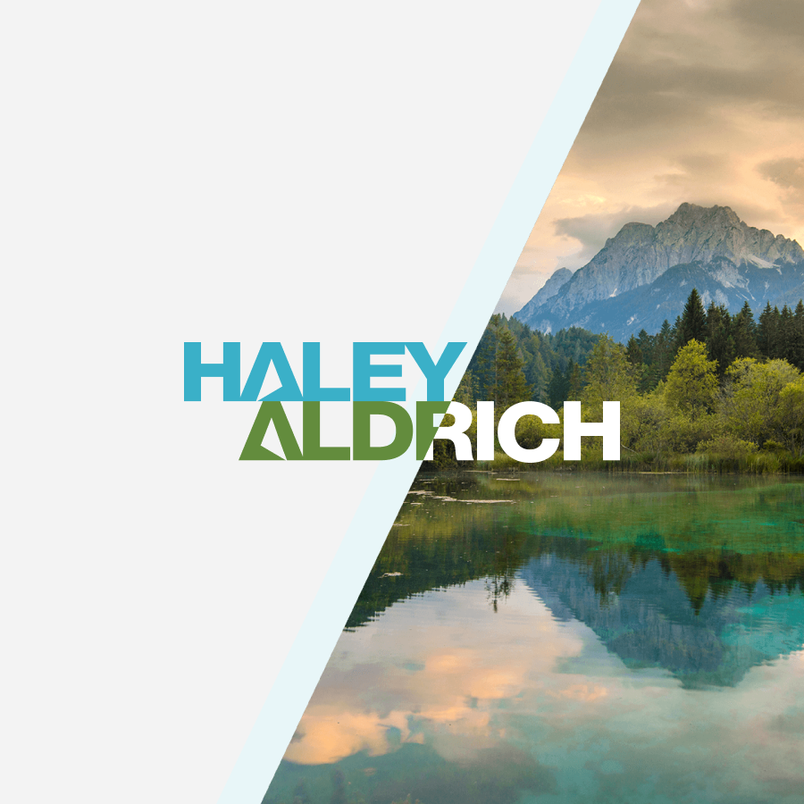 the haley and aldrich logo against a landscape with mountains, forest and a lake