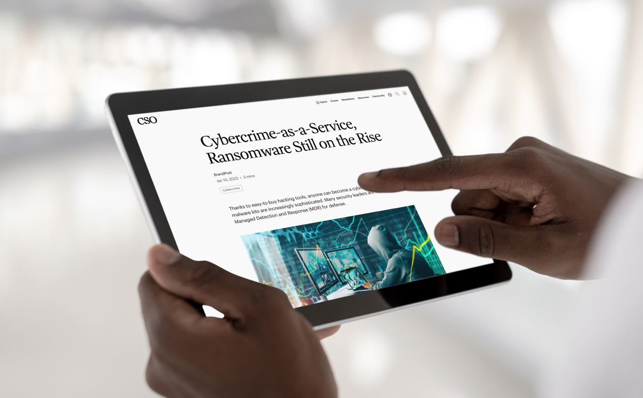 CSO sponsored article mocked up on iPad held by hands