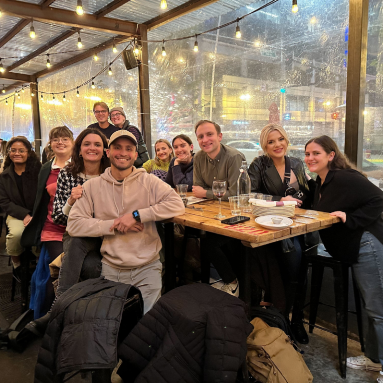 A group of people sitting outside at a restaurant