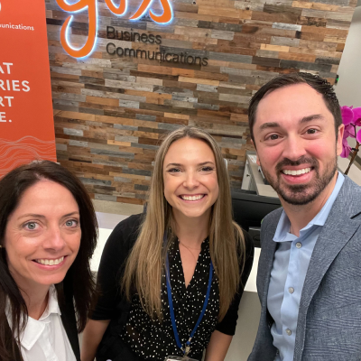 Three people taking a selfie at an event