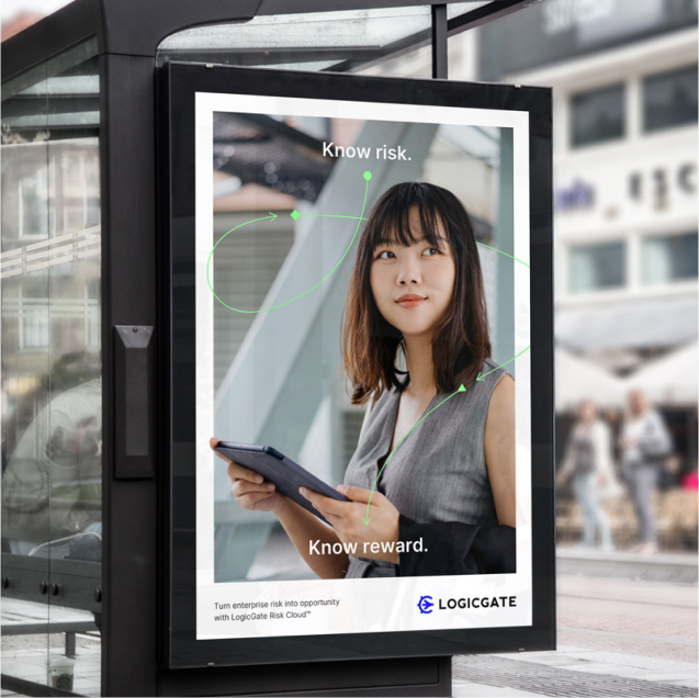 A woman is holding a tablet at a bus stop while being observed by a B2B Brand Identity Agency.