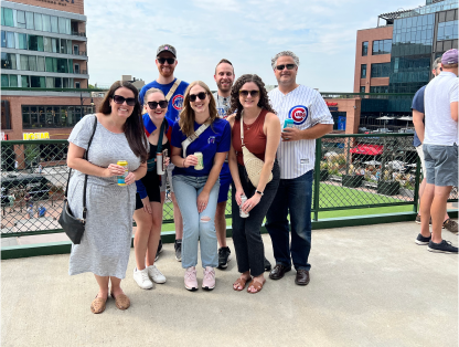 smiling Walker Sands employees at the annual Cubs game