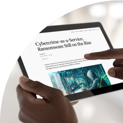 A person holding a tablet with the text cybercrime as a threat to ransomware in the cloud, assisted by a b2b technology marketing agency.