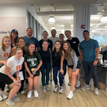 Group of employees taking a photo at the Walker Sands Chicago office