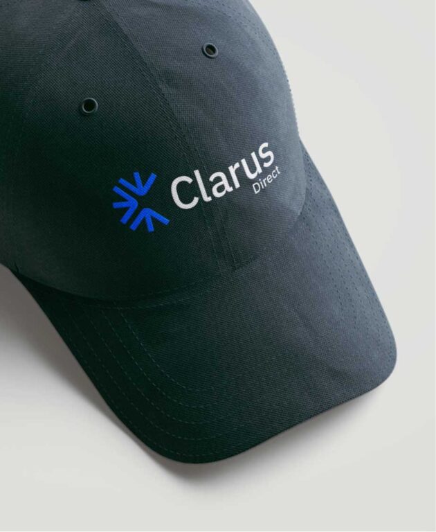 a black baseball hat with the clarus direct logo