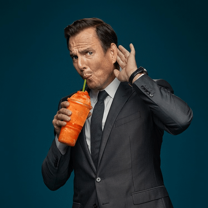 A man in a suit in various poses enjoying a refreshing carrot juice created by a B2B Creative Agency.