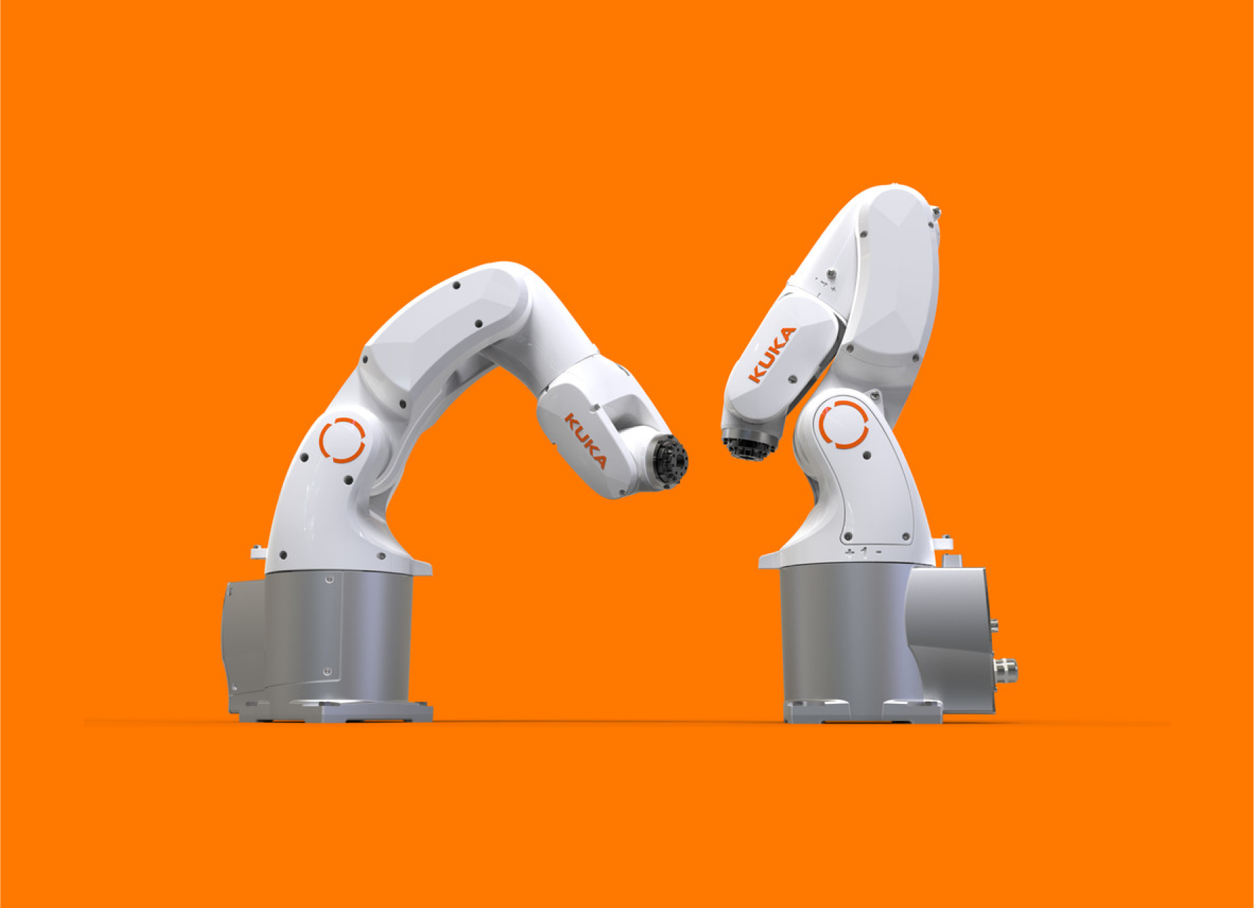 two Kuka industrial robots on an orange background