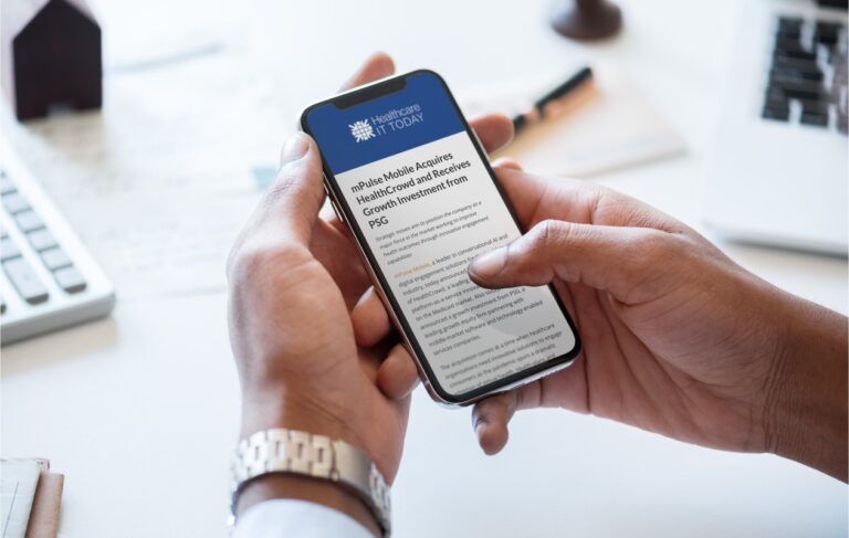 a person scrolls a healthcare IT today article about an mPulse acquisition on a mobile phone 