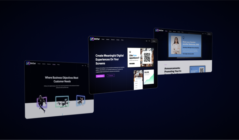 Rendering of three computer screens displaying revamped UPshow website against a dark background