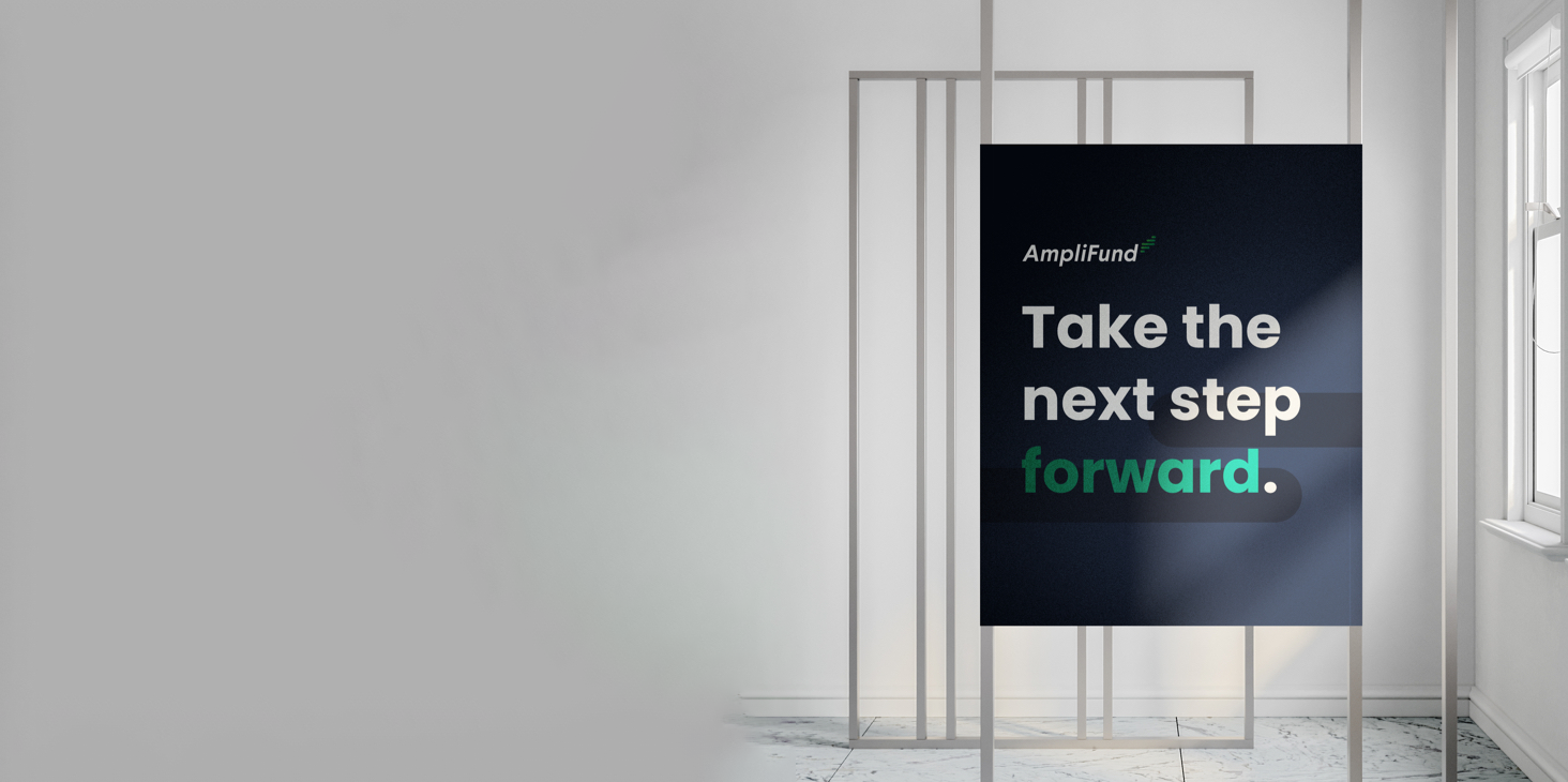 sign that reads "amplifund Take the next step forward" hanging in a white room