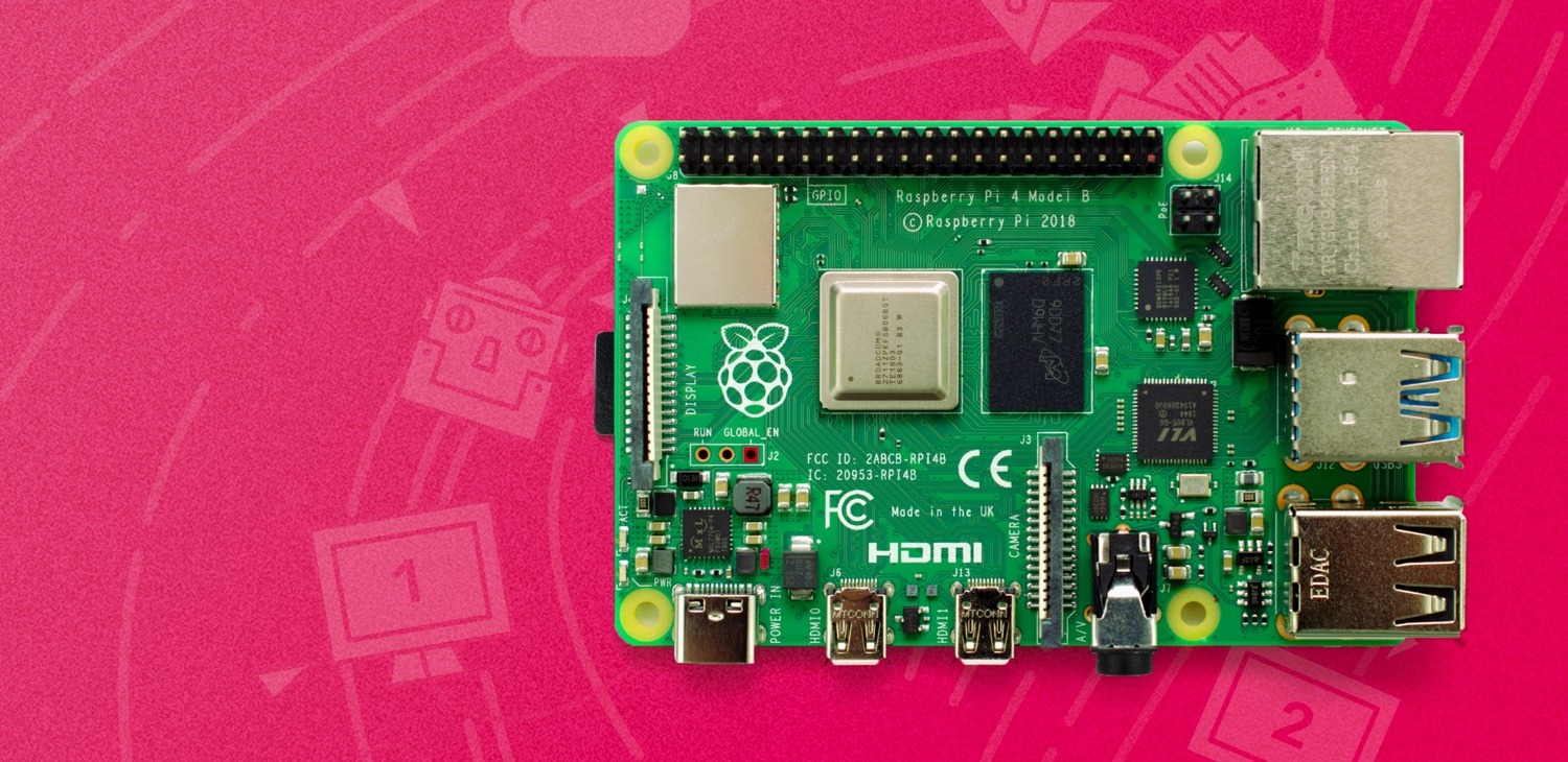a raspberry pi single board computer on a pink background