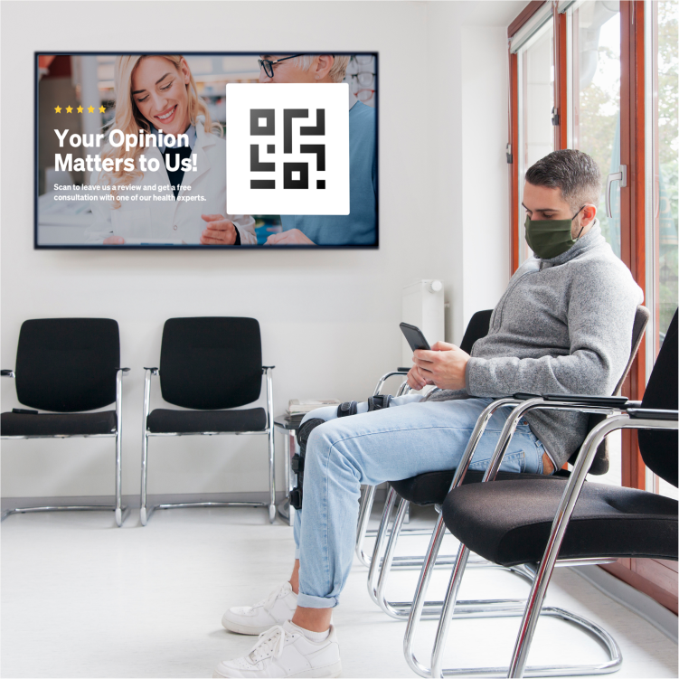 Man wearing leg brace in a waiting room with a TV in the background displaying an UPshow QR code with text that reads "Your opinion matter to us!" with an image of a doctor