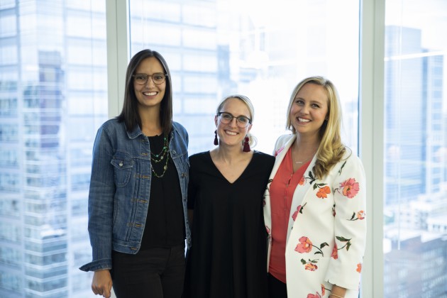 Annie Gudorf, Erin Spanski and Allison Ward standing next to each other in front of glass windows