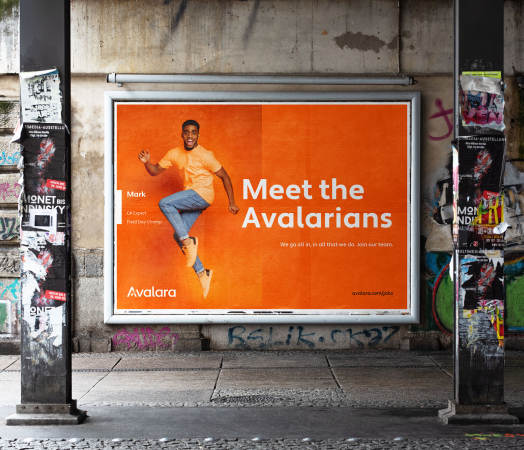 A an orange billboard using an outcome-based marketing approach